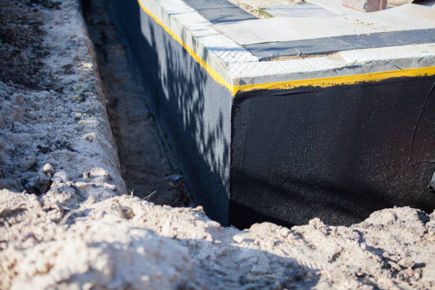 Professional Waterproofing technician working in Willard, NY